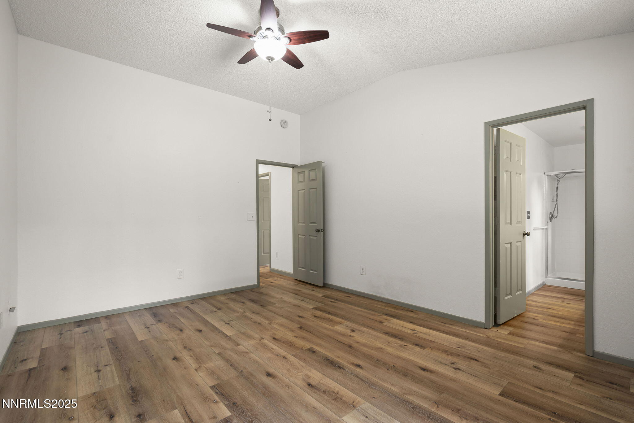 7690 Deep Bay Drive Reno, NV 89506 - Photo 14 of 26 a view of an empty room with wooden floor