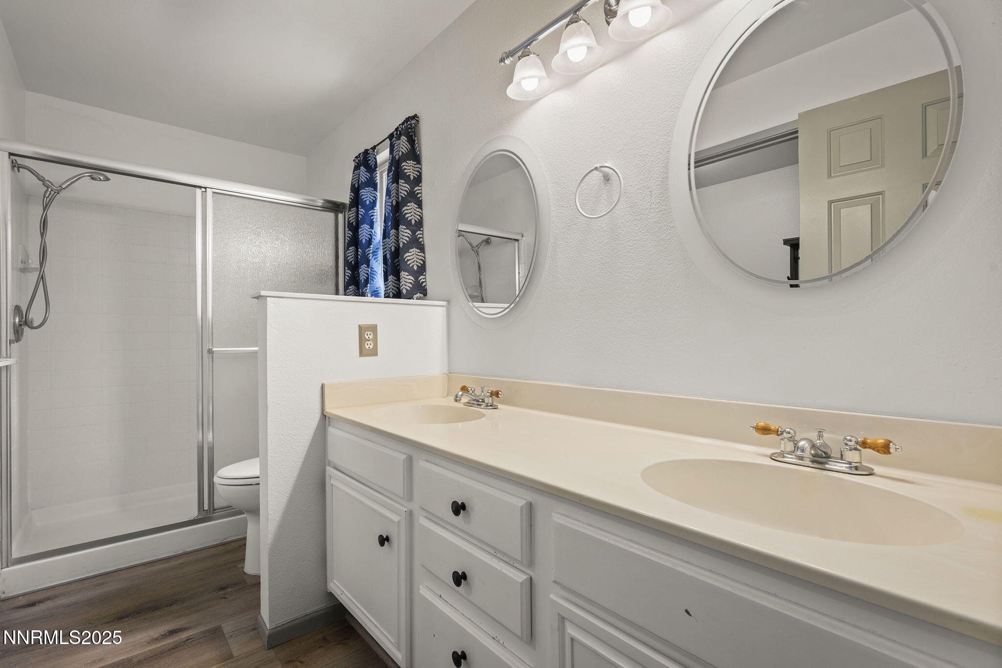 7690 Deep Bay Drive Reno, NV 89506 - Photo 16 of 26 a bathroom with a double vanity sink and mirror