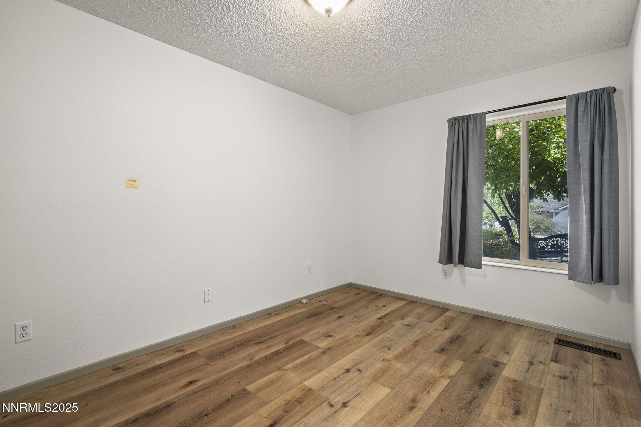 7690 Deep Bay Drive Reno, NV 89506 - Photo 20 of 26 an empty room with a window