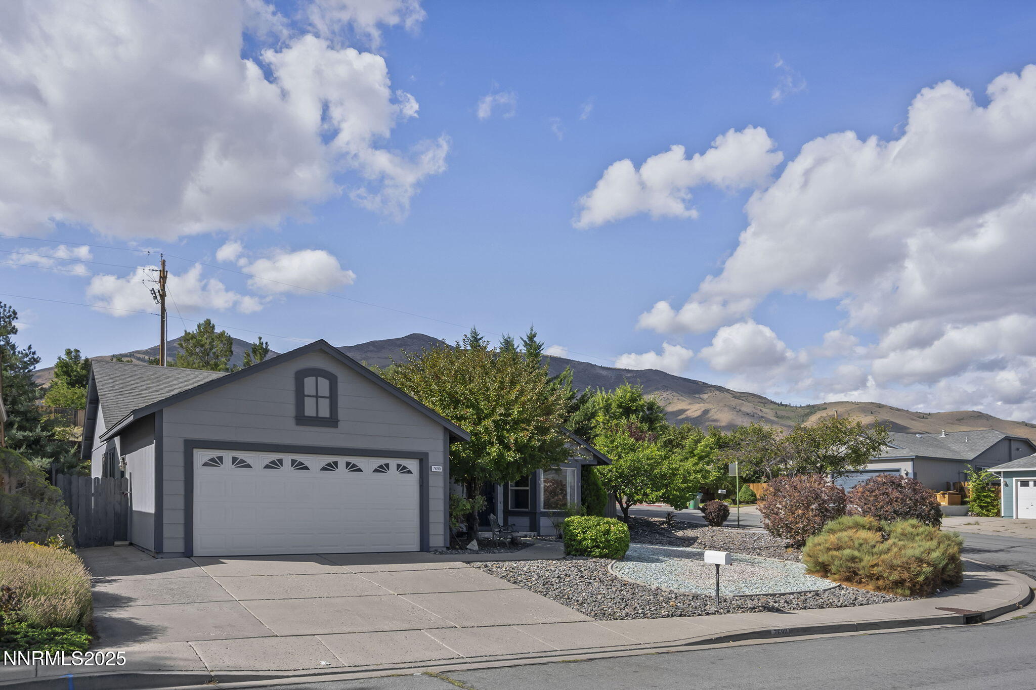 7690 Deep Bay Drive Reno, NV 89506 - Photo 2 of 26 a view of a house with a yard