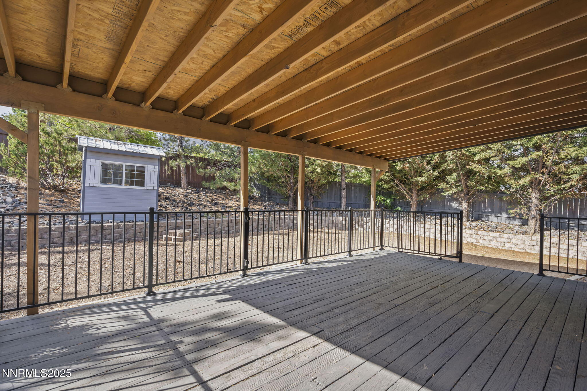 7690 Deep Bay Drive Reno, NV 89506 - Photo 21 of 26 a view of backyard with wooden deck