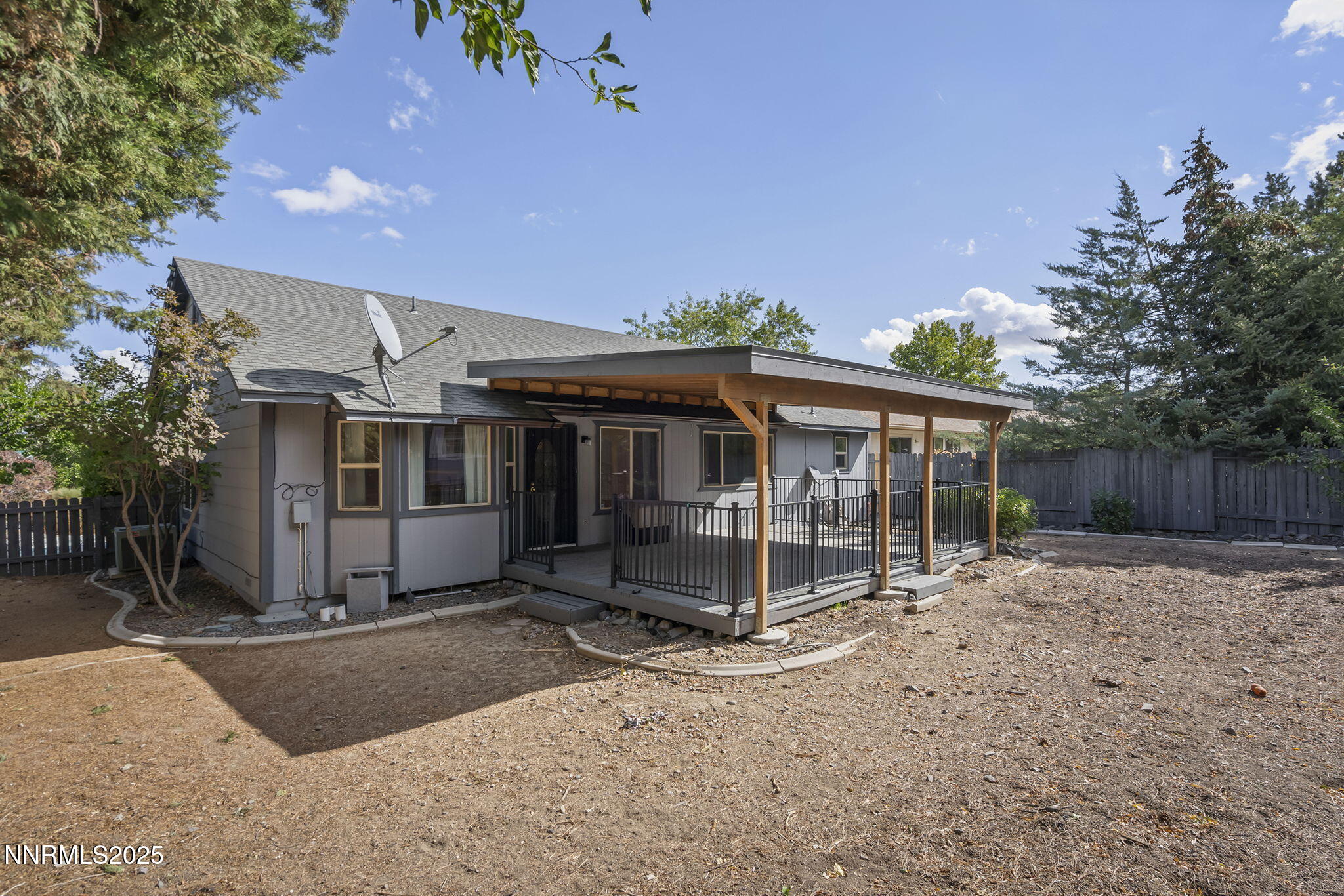 7690 Deep Bay Drive Reno, NV 89506 - Photo 25 of 26 a view of a house with a yard and wooden fence