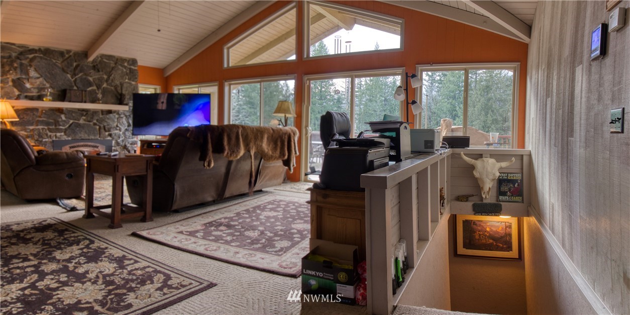 991 Lords Lake Loop Road Quilcene, WA 98376 - Photo 13 of 34 a view of living room with furniture and floor to ceiling window