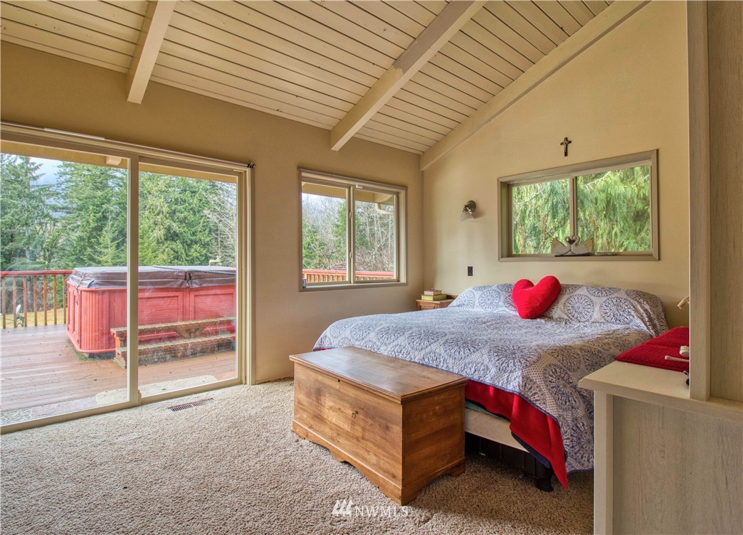 991 Lords Lake Loop Road Quilcene, WA 98376 - Photo 14 of 34 a bed room with a bed and a window