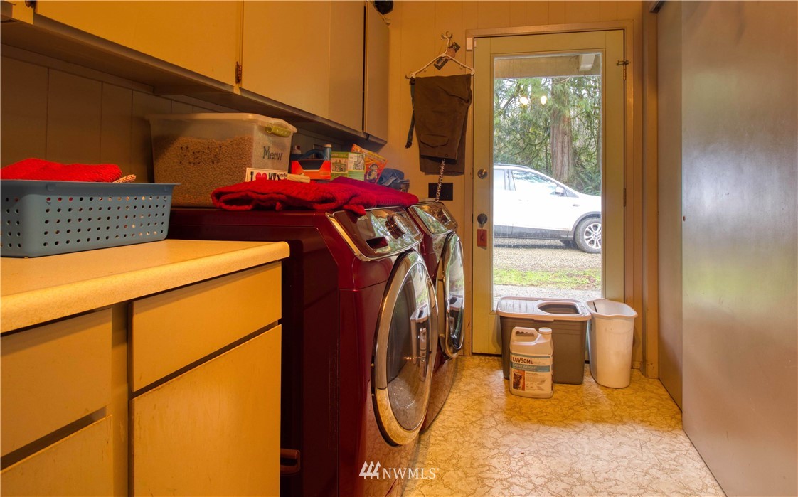 991 Lords Lake Loop Road Quilcene, WA 98376 - Photo 19 of 34 a utility room with dryer and washer