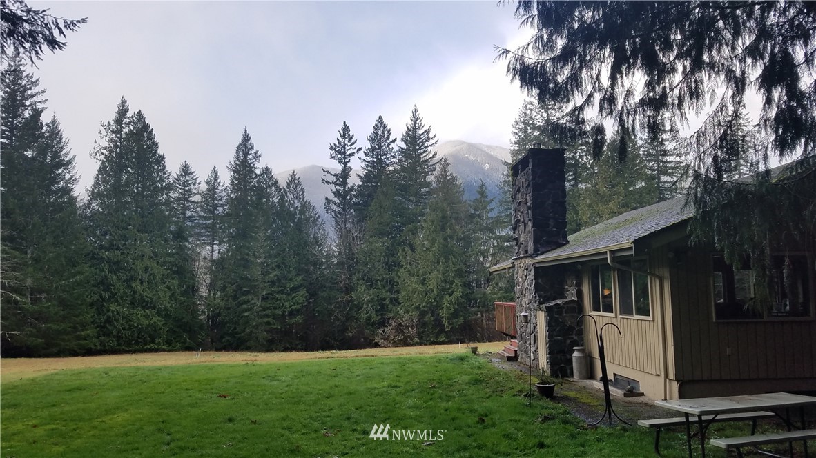 991 Lords Lake Loop Road Quilcene, WA 98376 - Photo 3 of 34 a view of a house with backyard