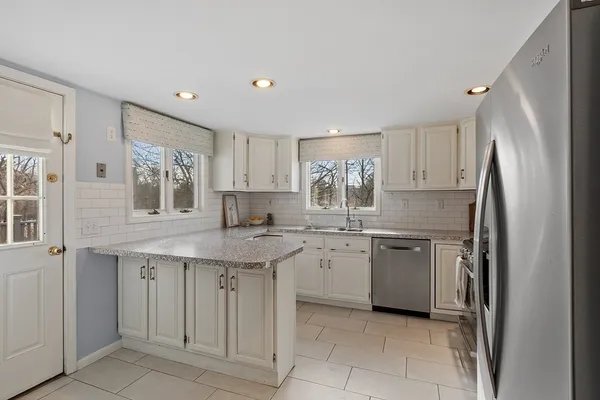 a kitchen with a sink stove and refrigerator