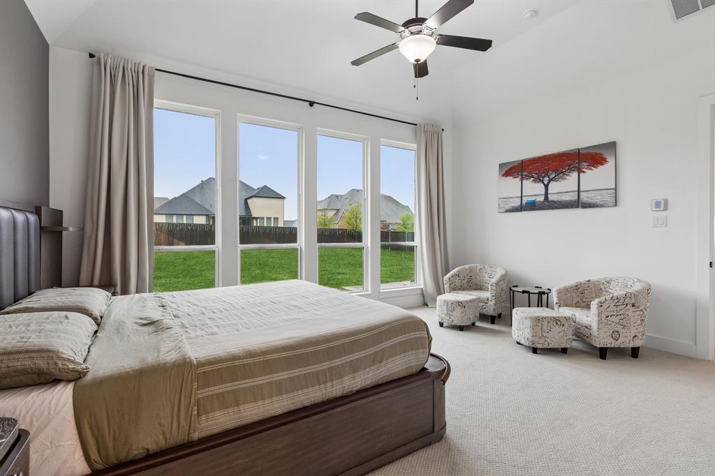 566 Broadleaf Way Haslet, TX 76052 - Photo 17 of 38 Spacious room featuring multiple large windows overlooking a green lawn