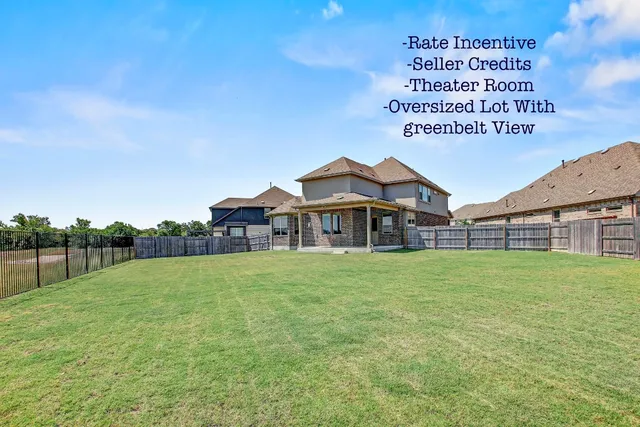 a sign board with grassy field