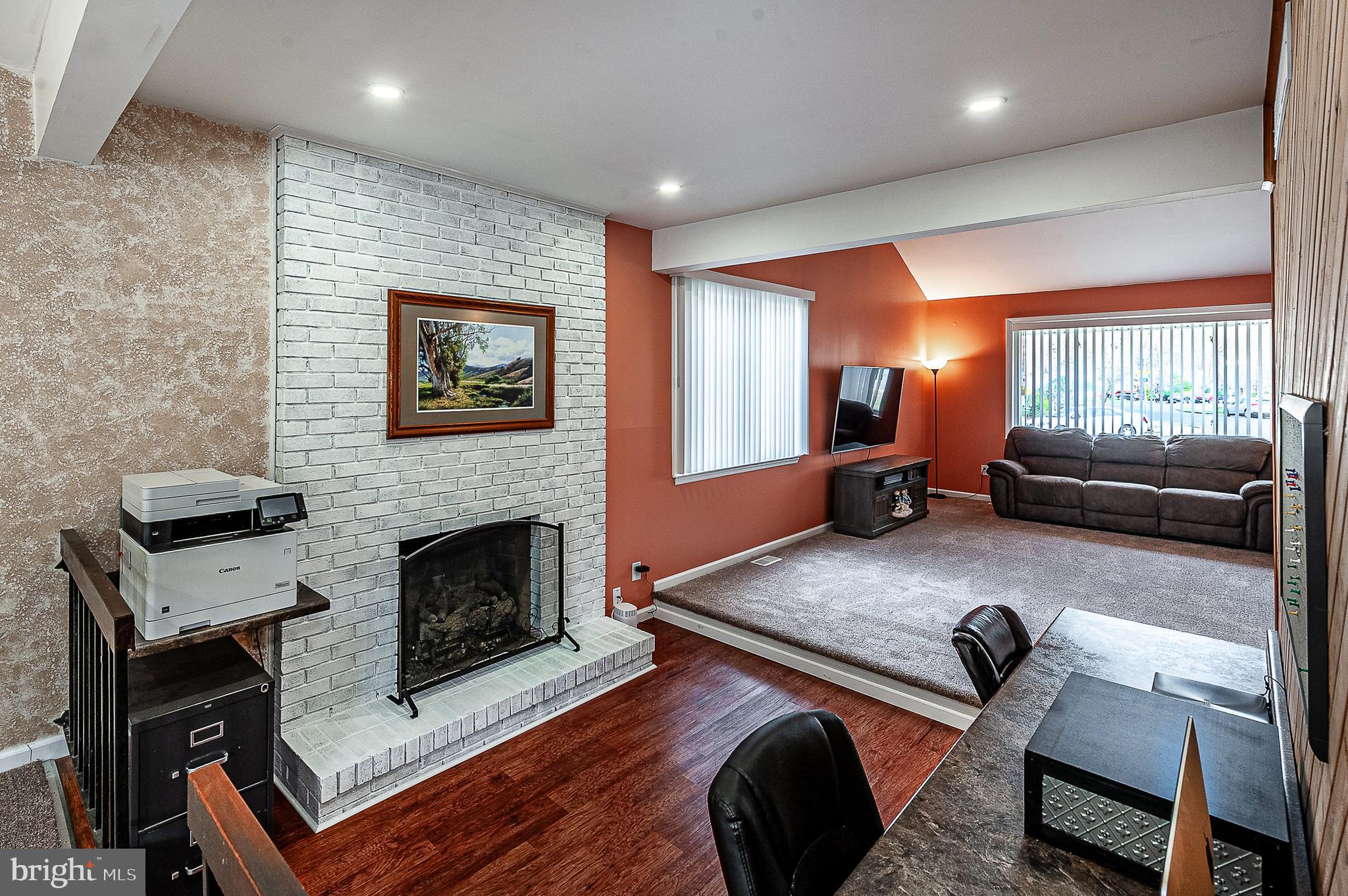 48 Aristone Drive Berlin, NJ 08009 - Photo 11 of 34 a living room with furniture and a fireplace