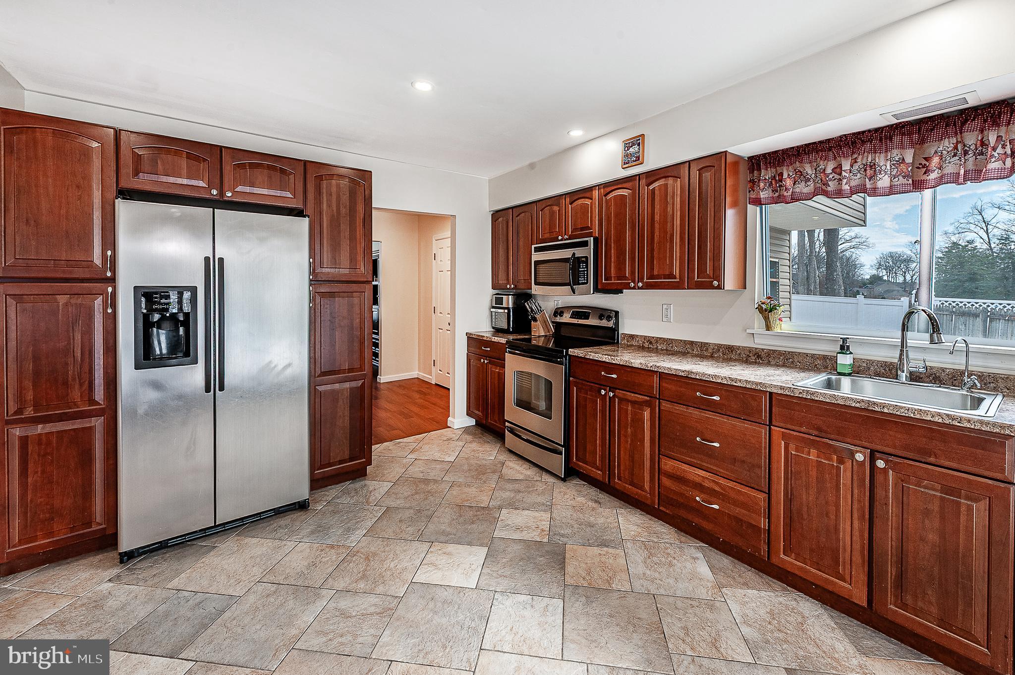 48 Aristone Drive Berlin, NJ 08009 - Photo 17 of 34 a kitchen with stainless steel appliances granite countertop a refrigerator and a sink
