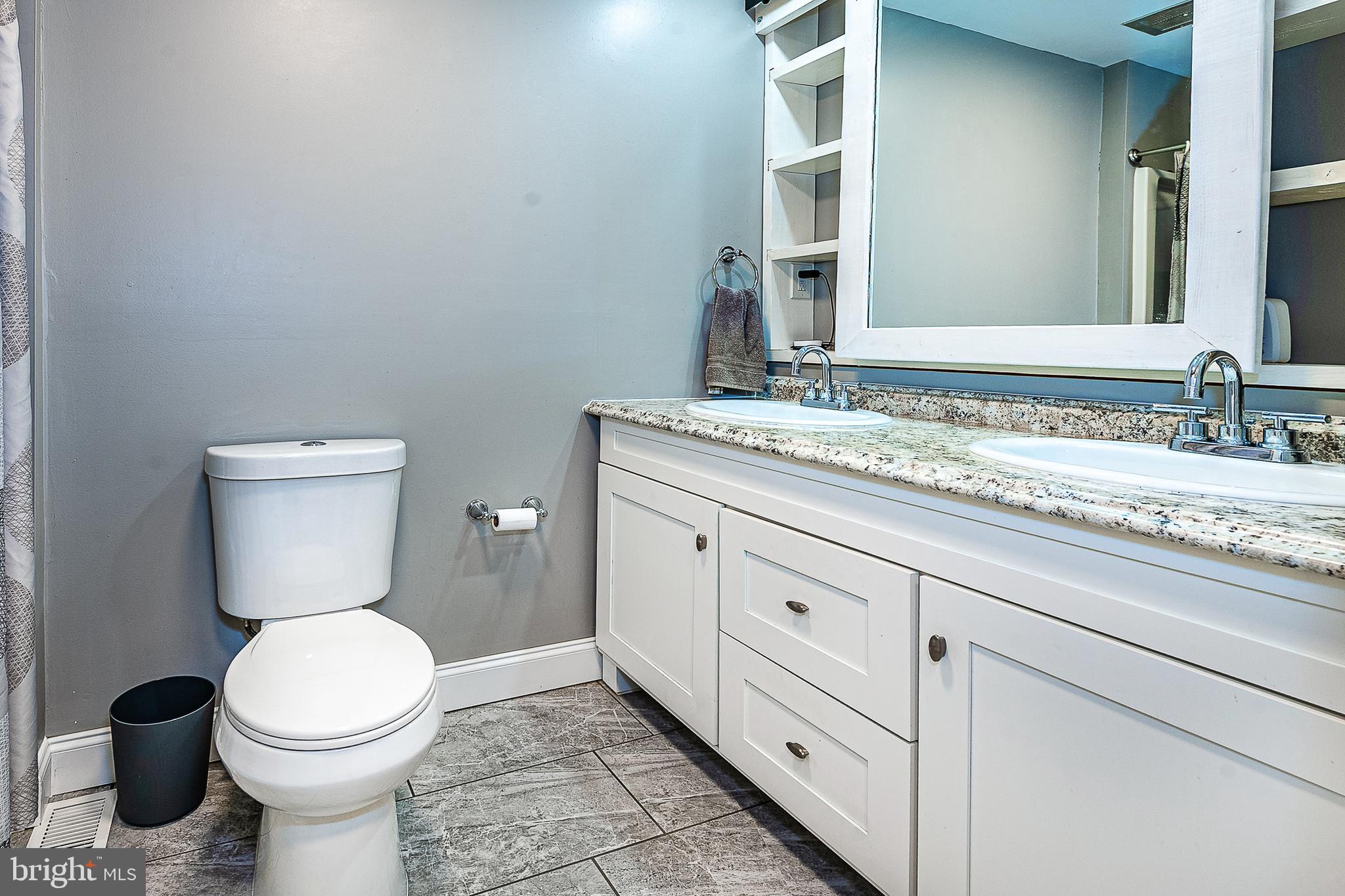 48 Aristone Drive Berlin, NJ 08009 - Photo 22 of 34 a bathroom with a granite countertop toilet sink and mirror