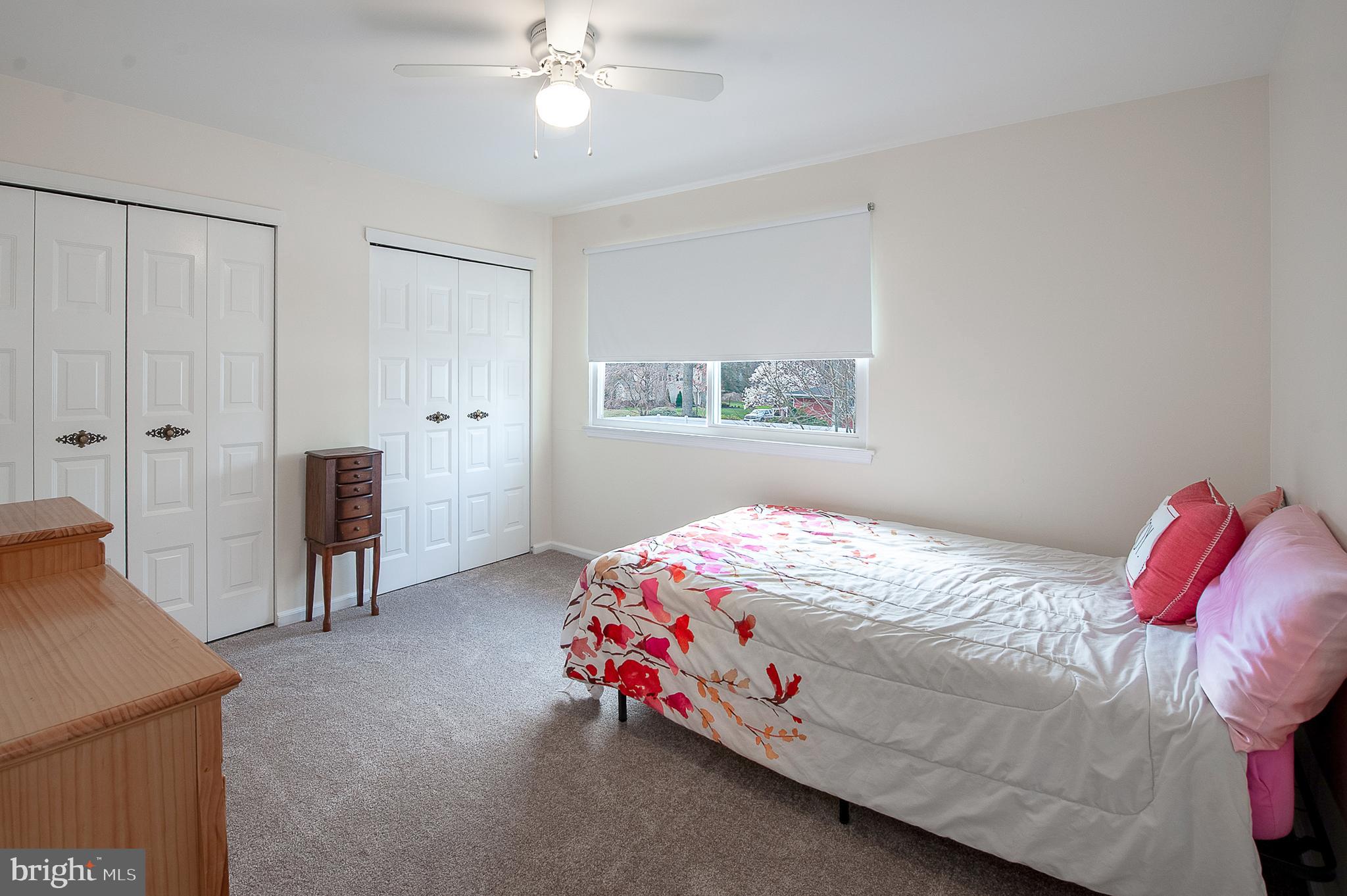 48 Aristone Drive Berlin, NJ 08009 - Photo 23 of 34 a bedroom with a bed and a chandelier