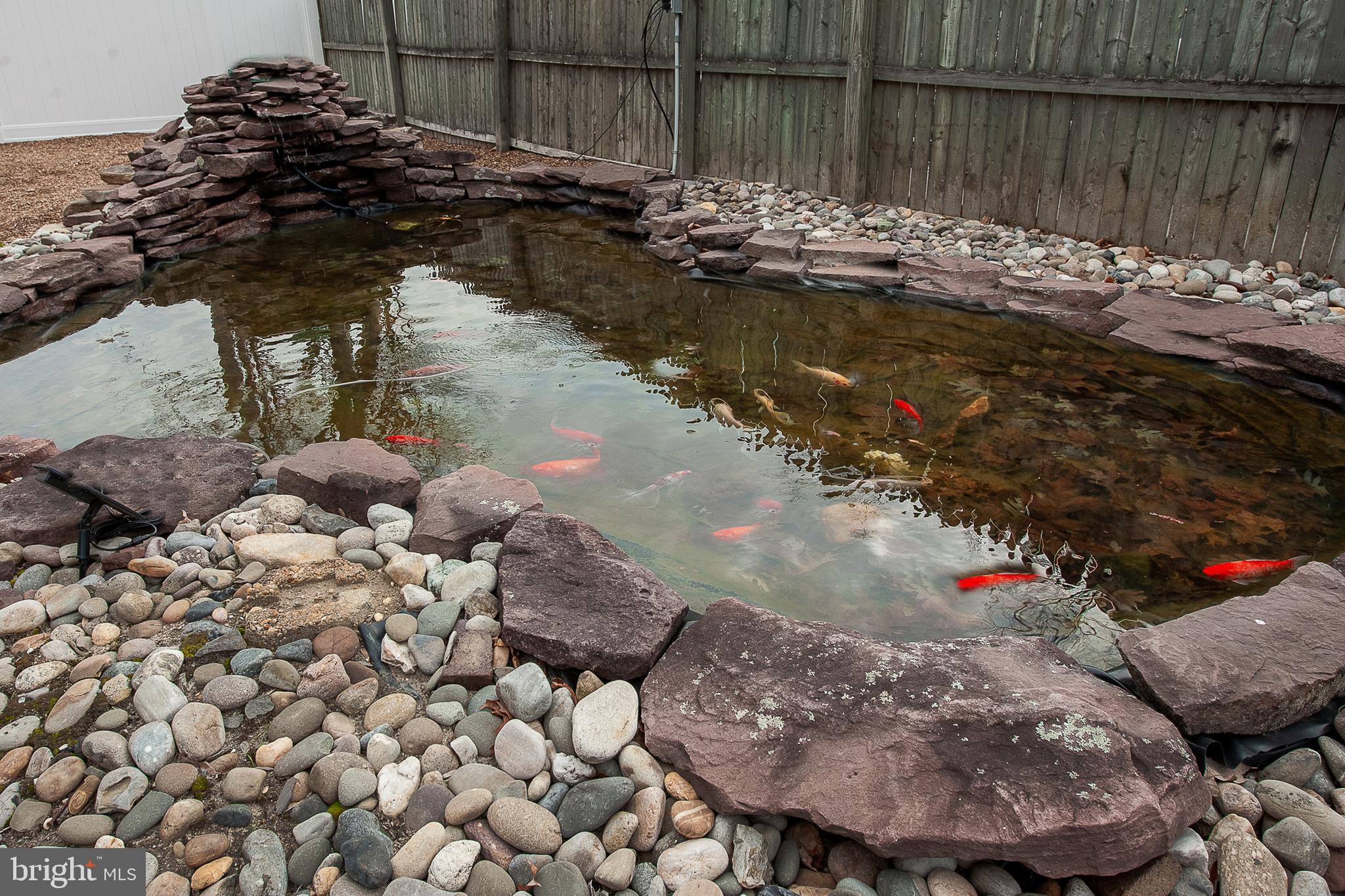 48 Aristone Drive Berlin, NJ 08009 - Photo 30 of 34 a view of a backyard of the house with a lake