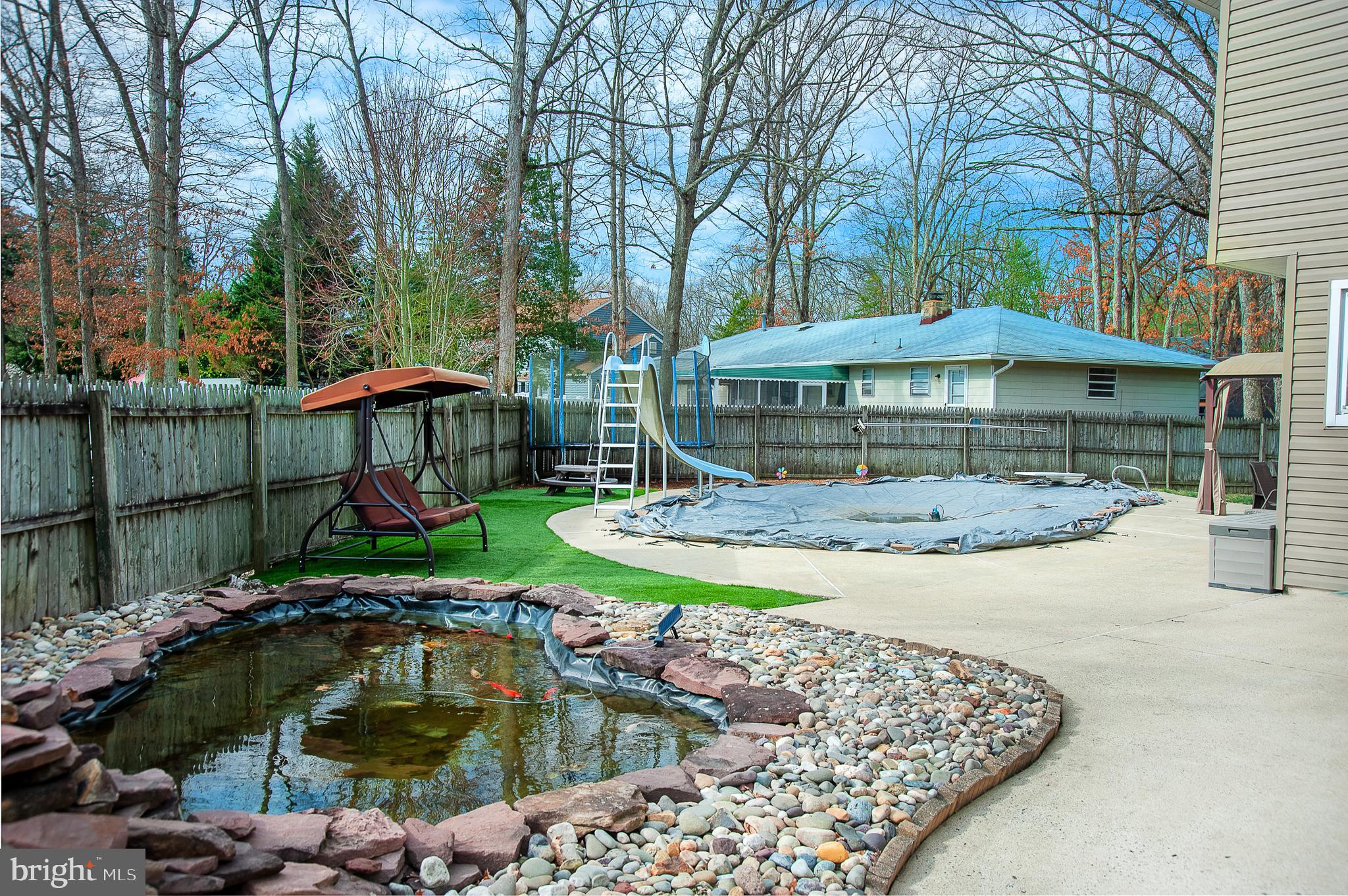 48 Aristone Drive Berlin, NJ 08009 - Photo 31 of 34 a view of a swimming pool with a patio