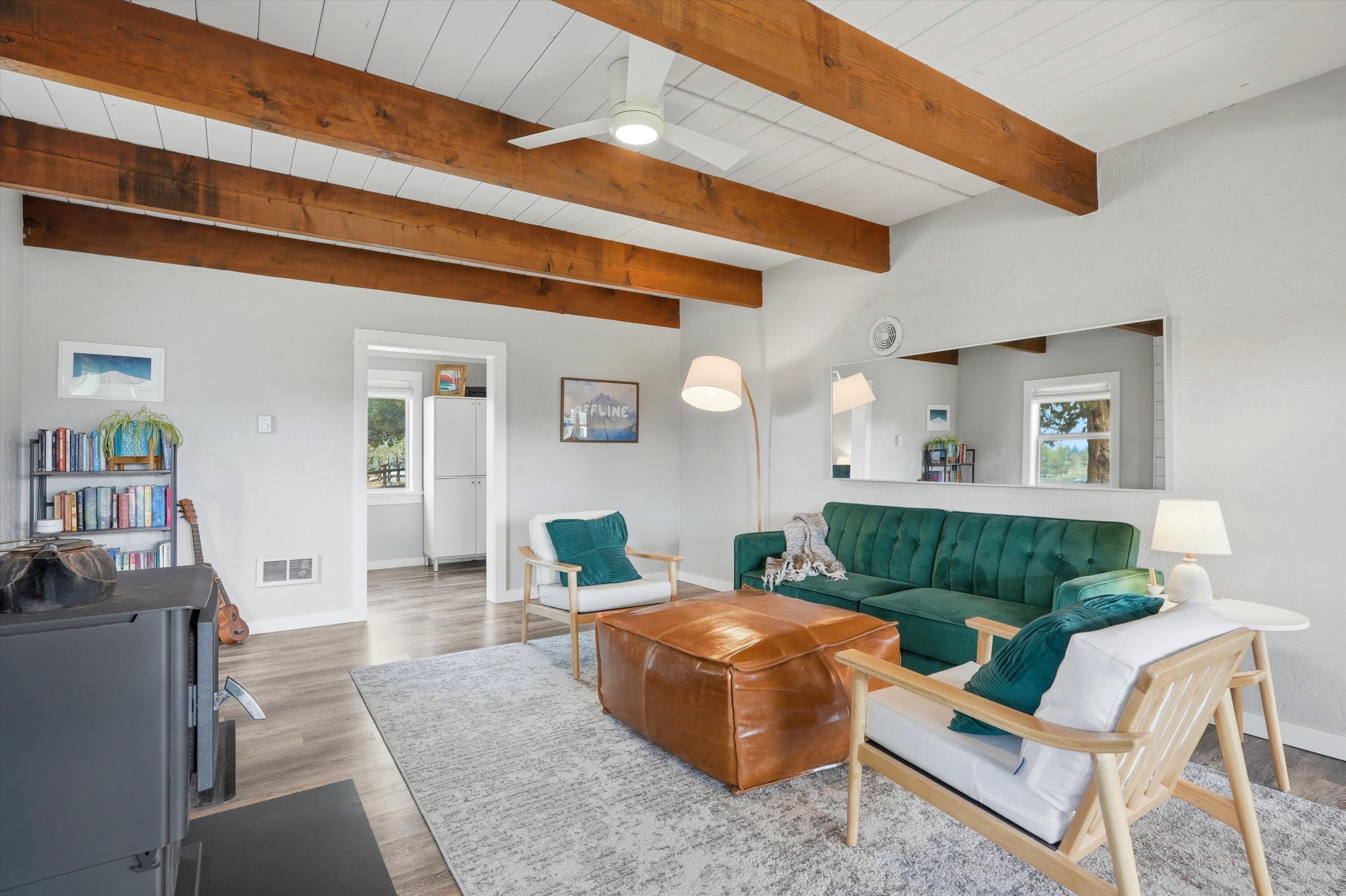 61280 Larsen Road Bend, OR 97702 - Photo 6 of 58 a living room with furniture and a wooden floor