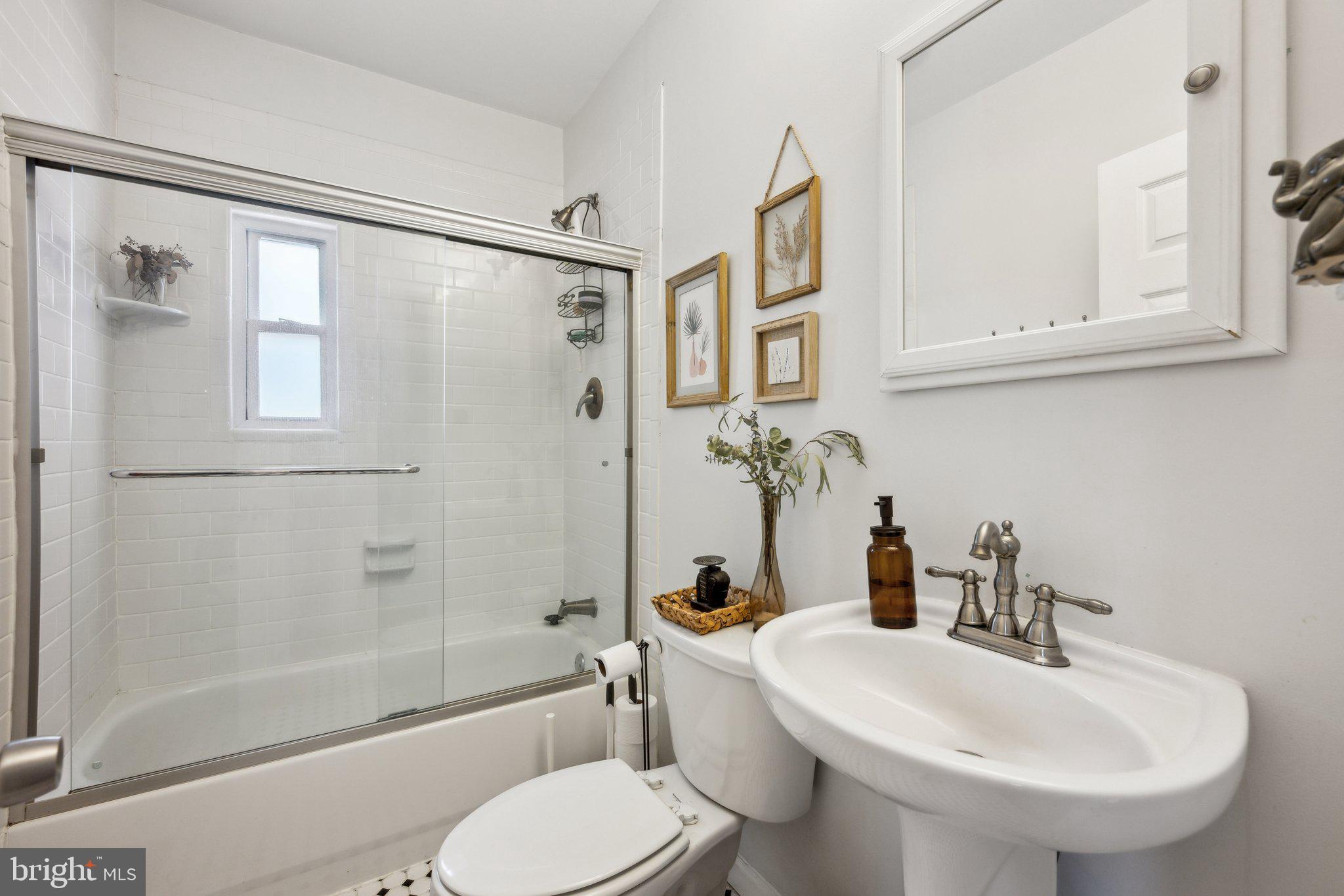 8116 Beverly Road Severn, MD 21144 - Photo 15 of 24 a bathroom with a sink toilet and shower