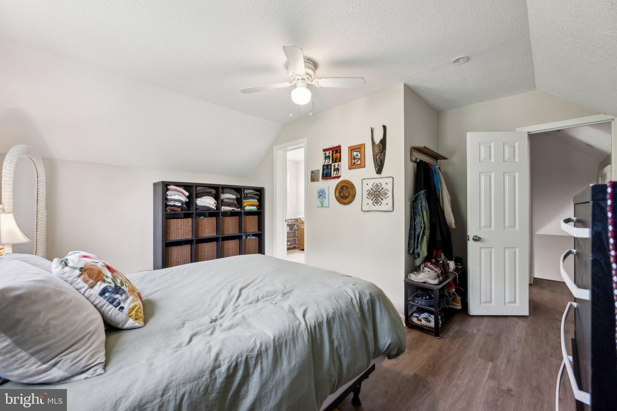 8116 Beverly Road Severn, MD 21144 - Photo 17 of 24 a bedroom with a bed furniture and a flat screen tv