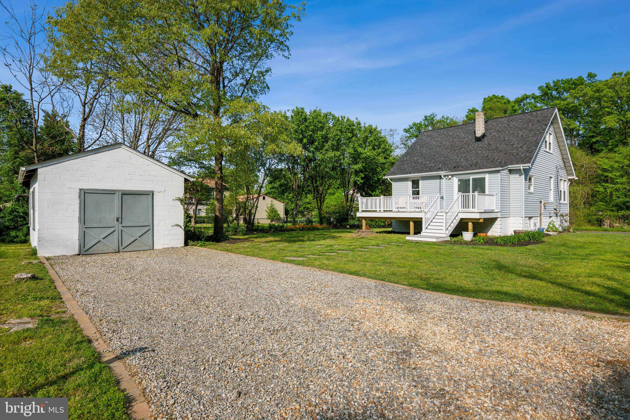 8116 Beverly Road Severn, MD 21144 - Photo 3 of 24 a front view of a house with a yard and garage
