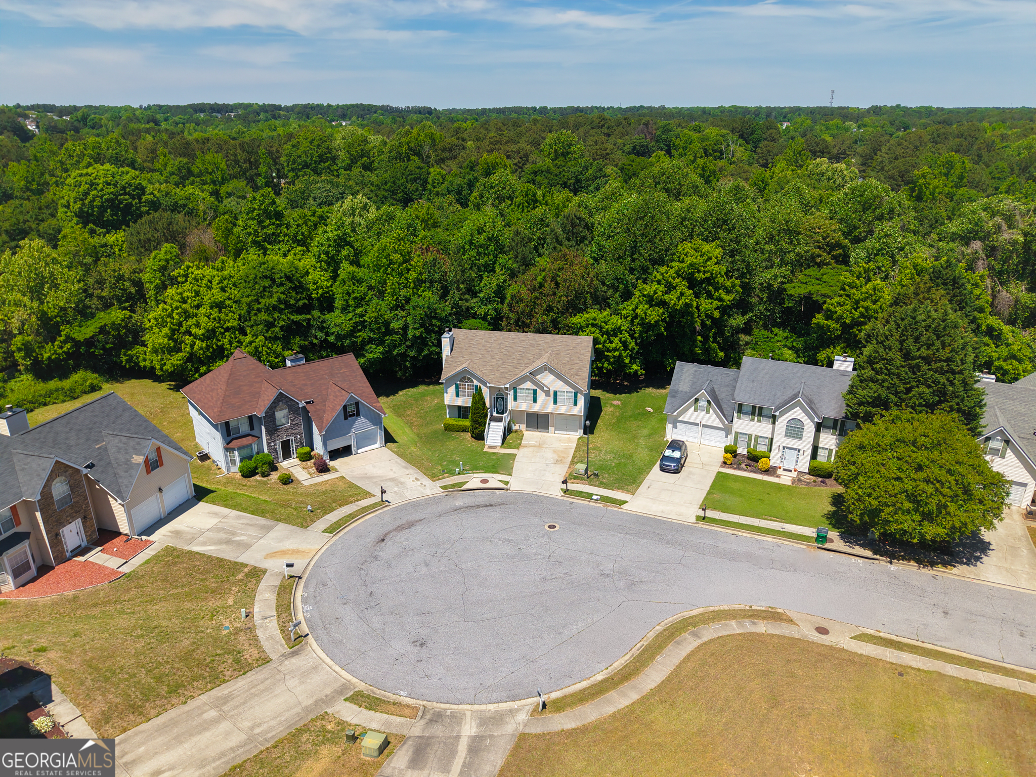 11036 Pebble Ridge Drive Hampton, GA 30228 - Photo 2 of 35 an aerial view of a house with swimming pool and green space