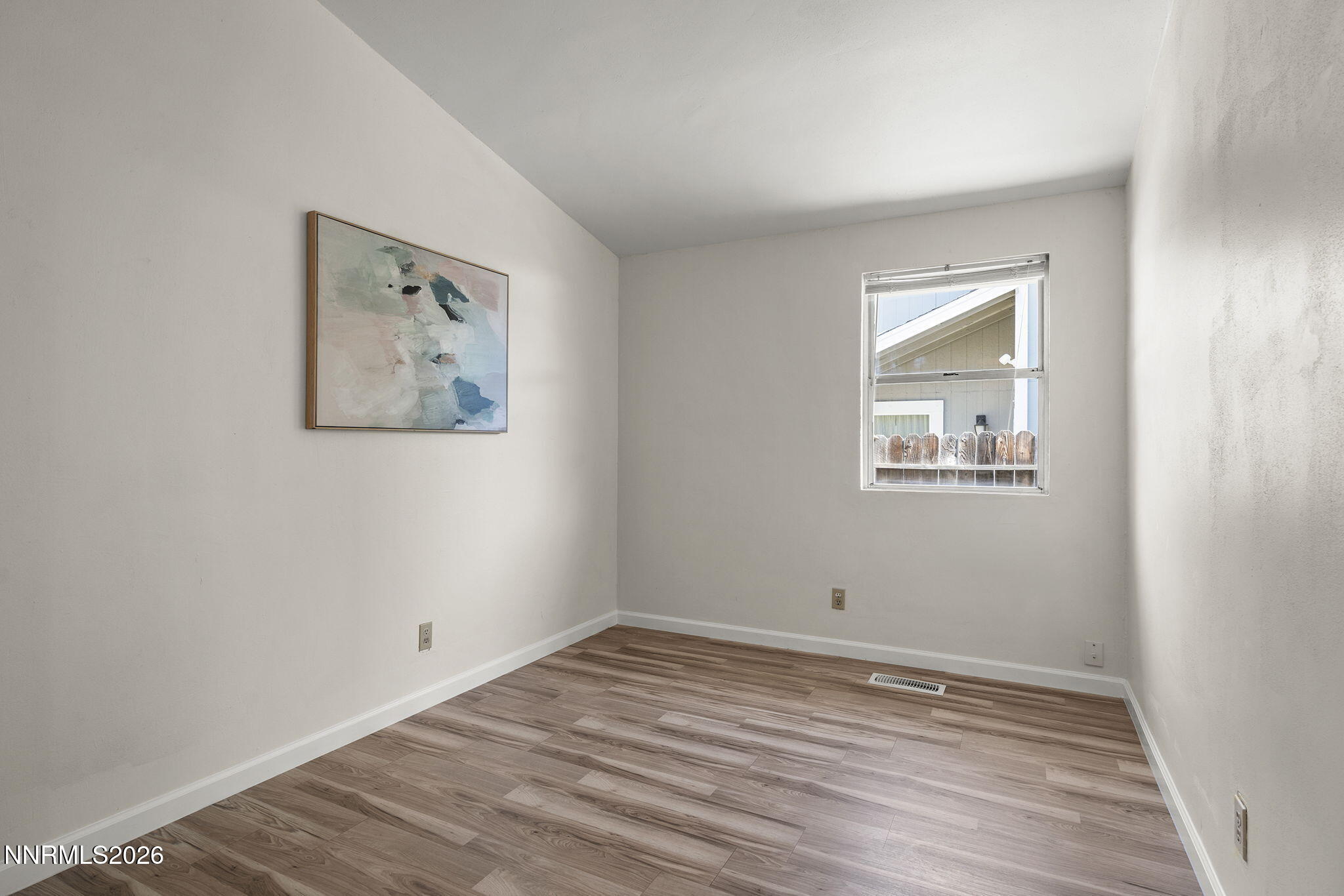 6290 Chesterfield Lane Reno, NV 89523 - Photo 17 of 21 a view of empty room with wooden floor