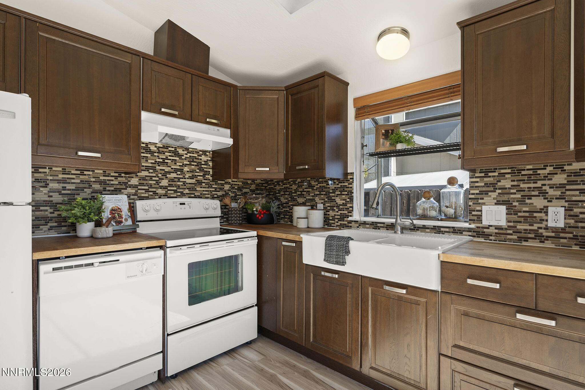 6290 Chesterfield Lane Reno, NV 89523 - Photo 4 of 21 a kitchen with appliances cabinets and a counter top space