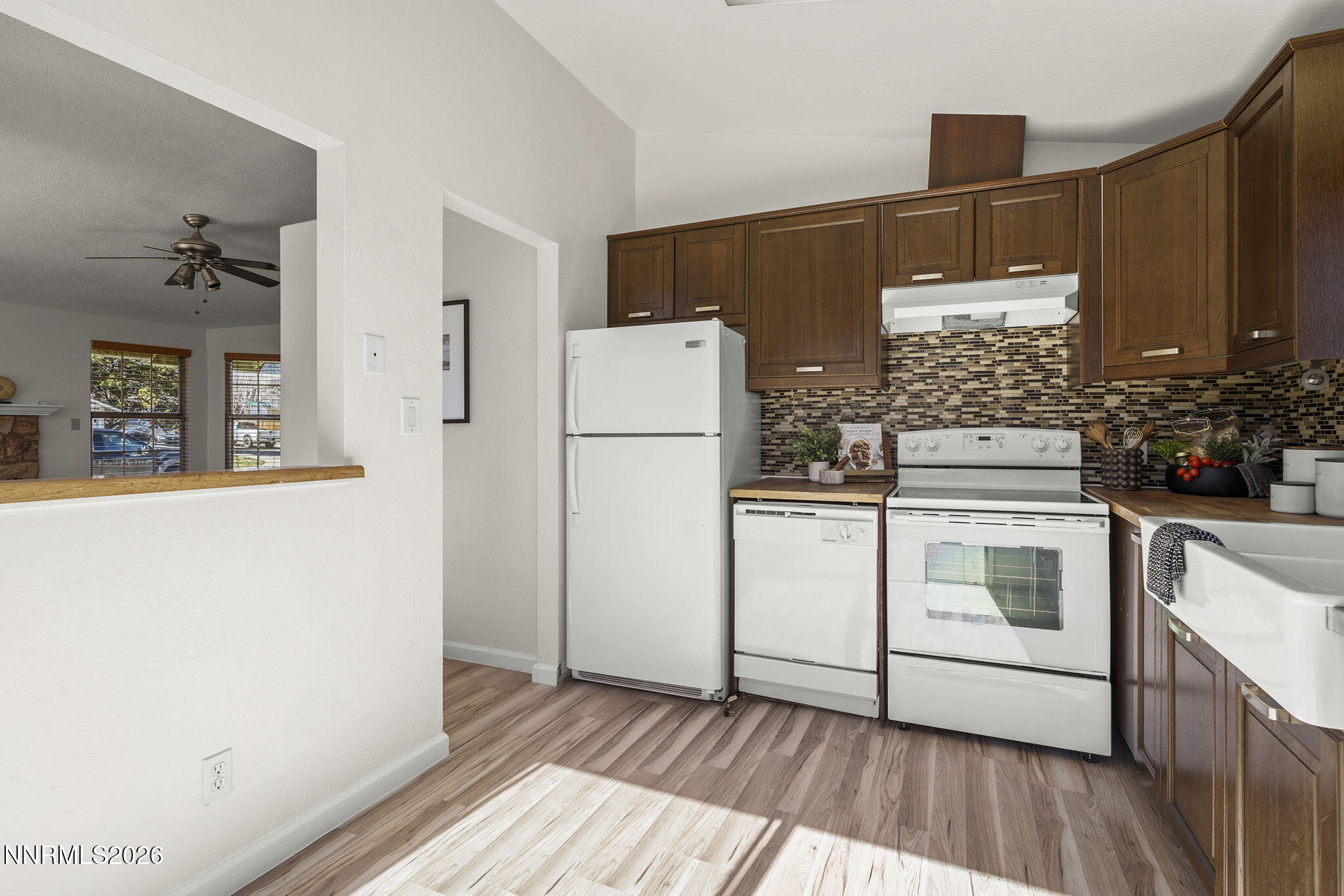 6290 Chesterfield Lane Reno, NV 89523 - Photo 5 of 21 a kitchen with a stove a refrigerator and a cabinets