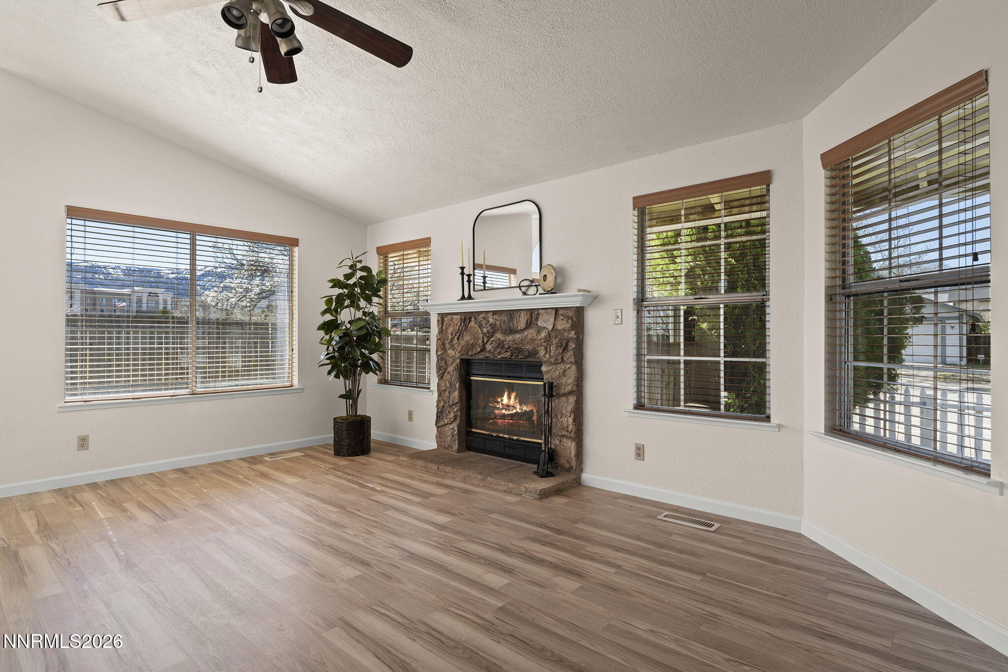 6290 Chesterfield Lane Reno, NV 89523 - Photo 9 of 21 a view of an empty room with a window and fireplace