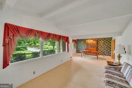 111 Roberson Street Dublin, GA 31021 - Photo 5 of 15 a view of a room with a large window and sitting area