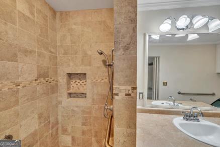 111 Roberson Street Dublin, GA 31021 - Photo 9 of 15 a bathroom with a sink shower and a mirror