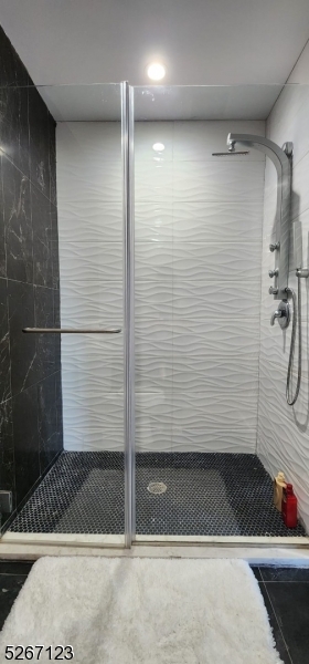 58 Elm Street, Unit 601 Newark, NJ 07105 - Photo 13 of 15 a bathroom with a shower