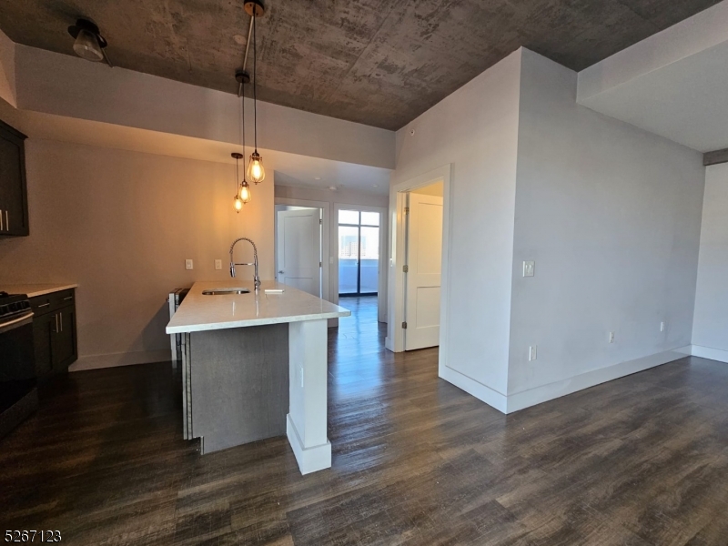 58 Elm Street, Unit 601 Newark, NJ 07105 - Photo 14 of 15 a view of a room with wooden floor and a sink
