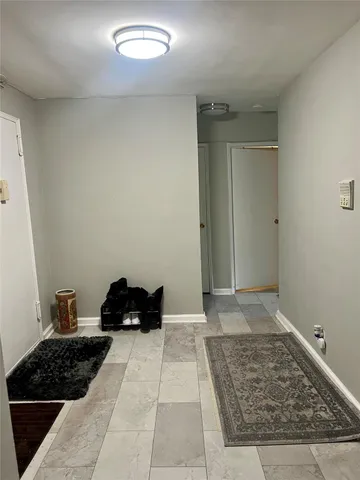 a view of a closet area with rug