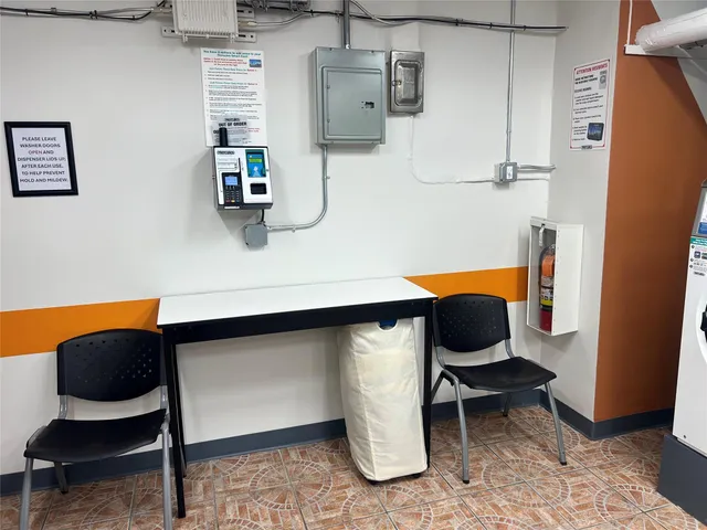 a work place with wooden floor and furniture