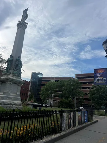 a view of street with sitting area