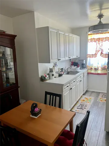 a kitchen with a table chairs and a dining table
