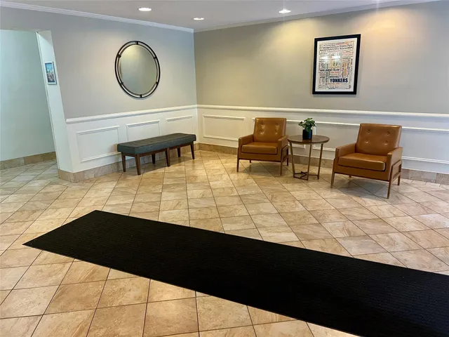 a living room with chair and a table