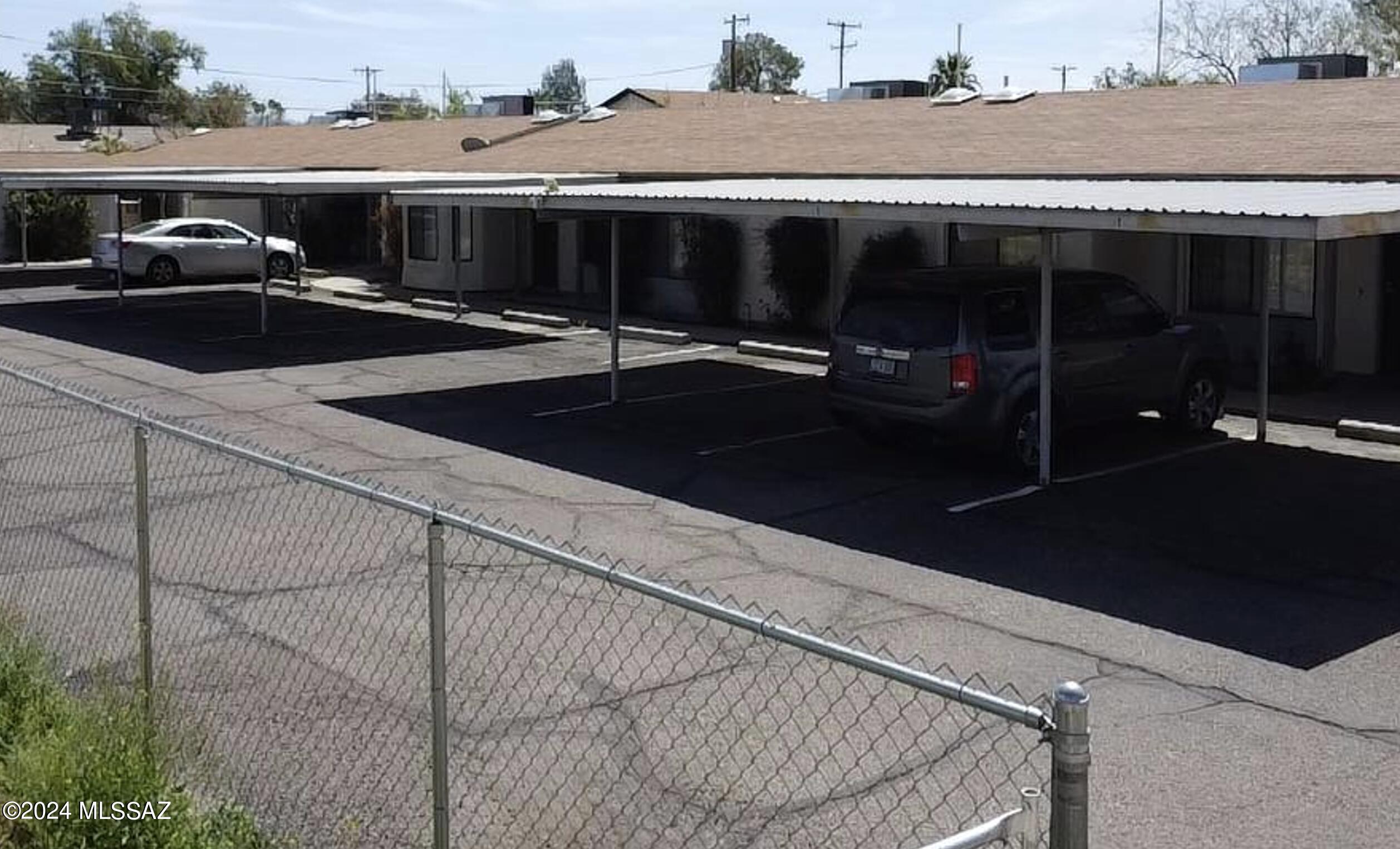 2118 North Ralph Avenue Tucson, AZ 85712 - Photo 1 of 10 a car parked in front of a house
