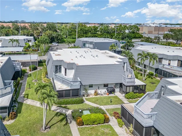 an aerial view of a house with a garden and plants