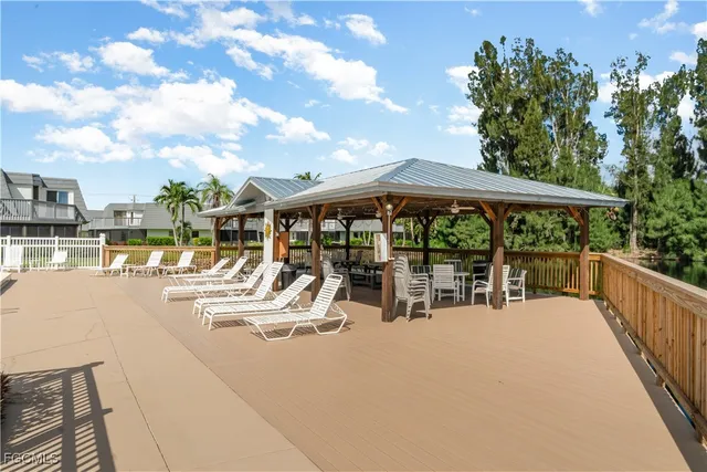 a view of pool with outdoor seating
