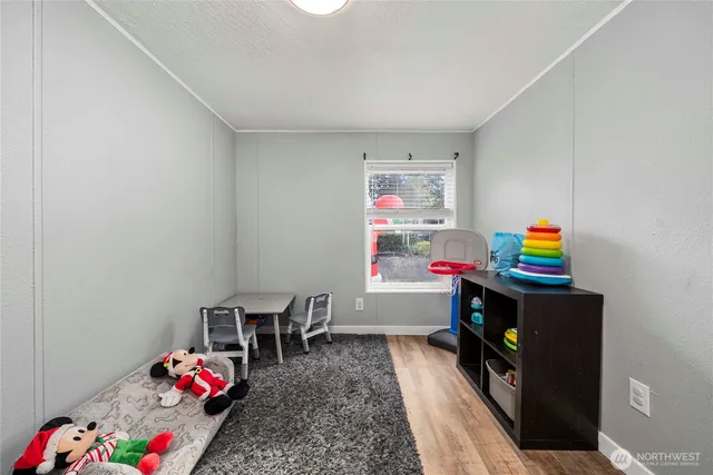 a room with toys and wooden floor