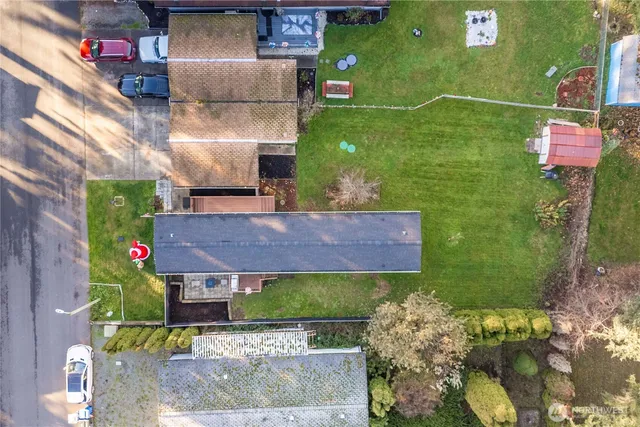 a aerial view of a house with a yard