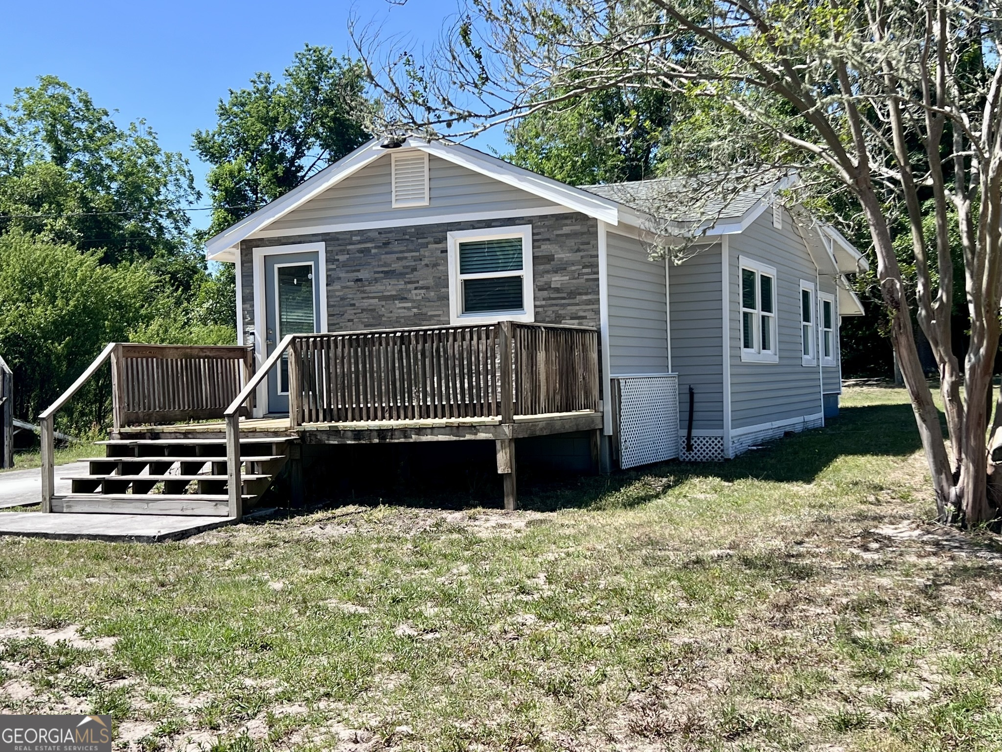 145 Sycamore Street Jesup, GA 31545 - Photo 1 of 14 a view of a house with a yard