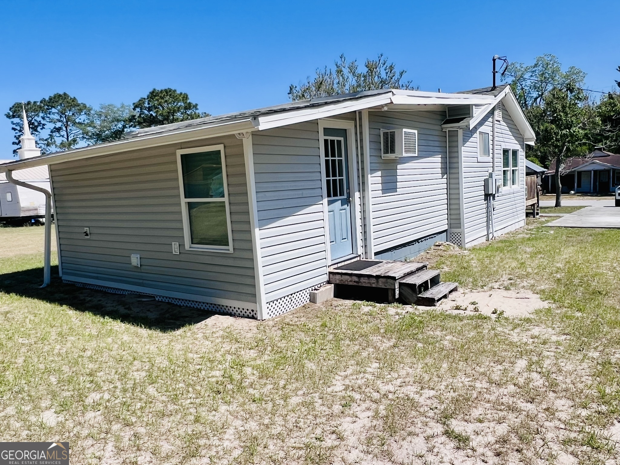 145 Sycamore Street Jesup, GA 31545 - Photo 14 of 14 a view of a house with a yard