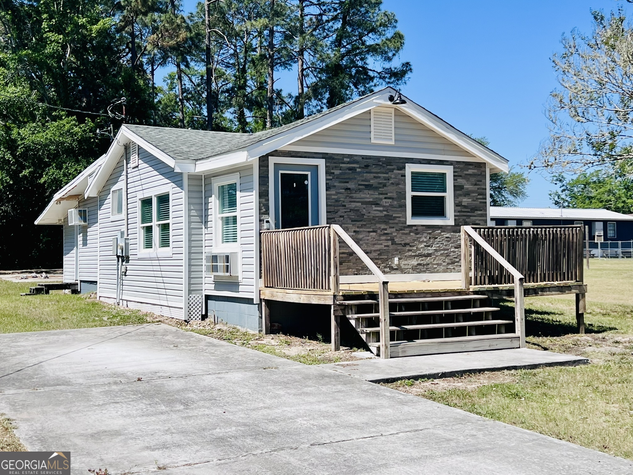 145 Sycamore Street Jesup, GA 31545 - Photo 2 of 14 a front view of a house with a yard