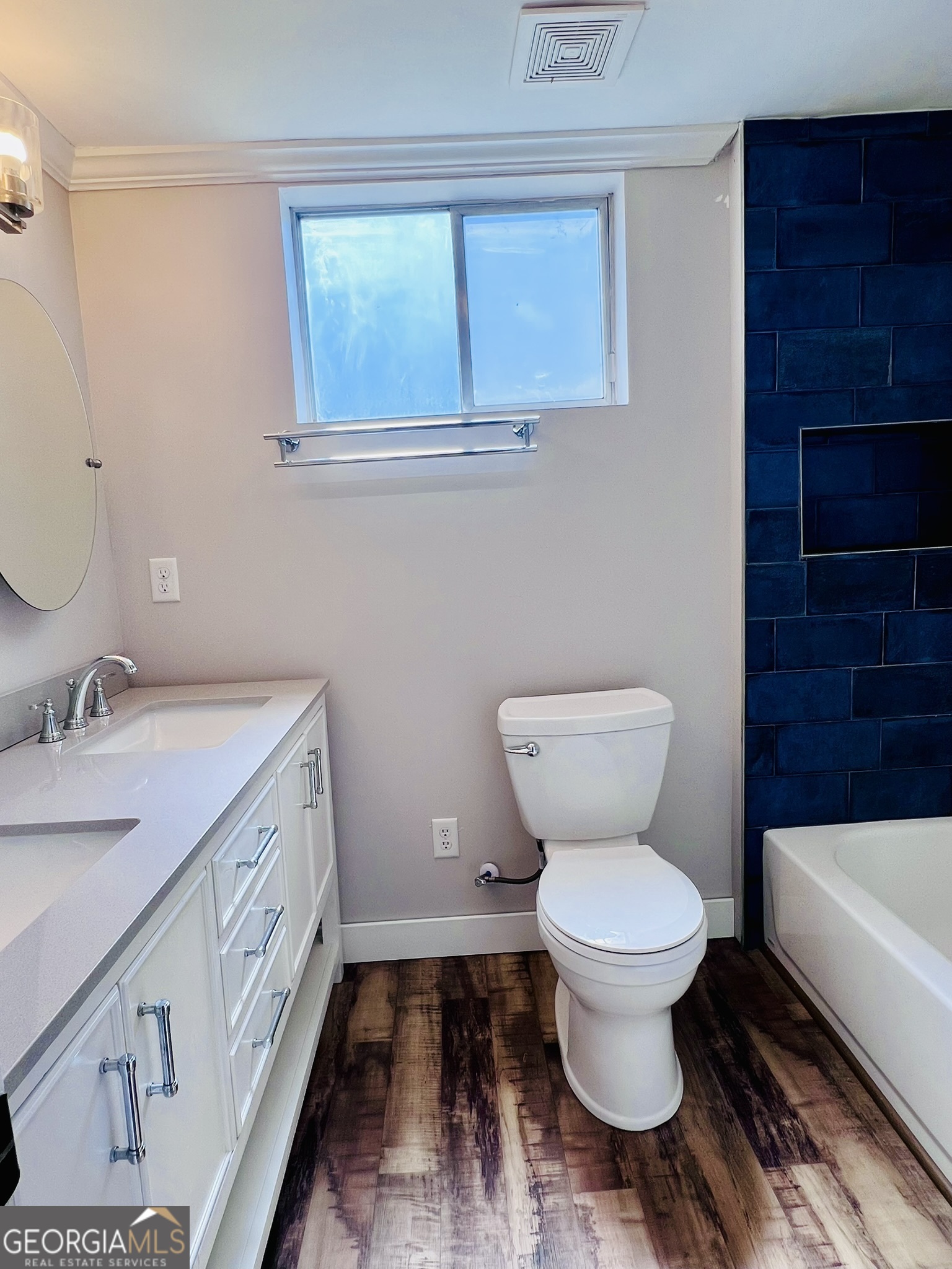 145 Sycamore Street Jesup, GA 31545 - Photo 8 of 14 a bathroom with a sink toilet vanity and toilet