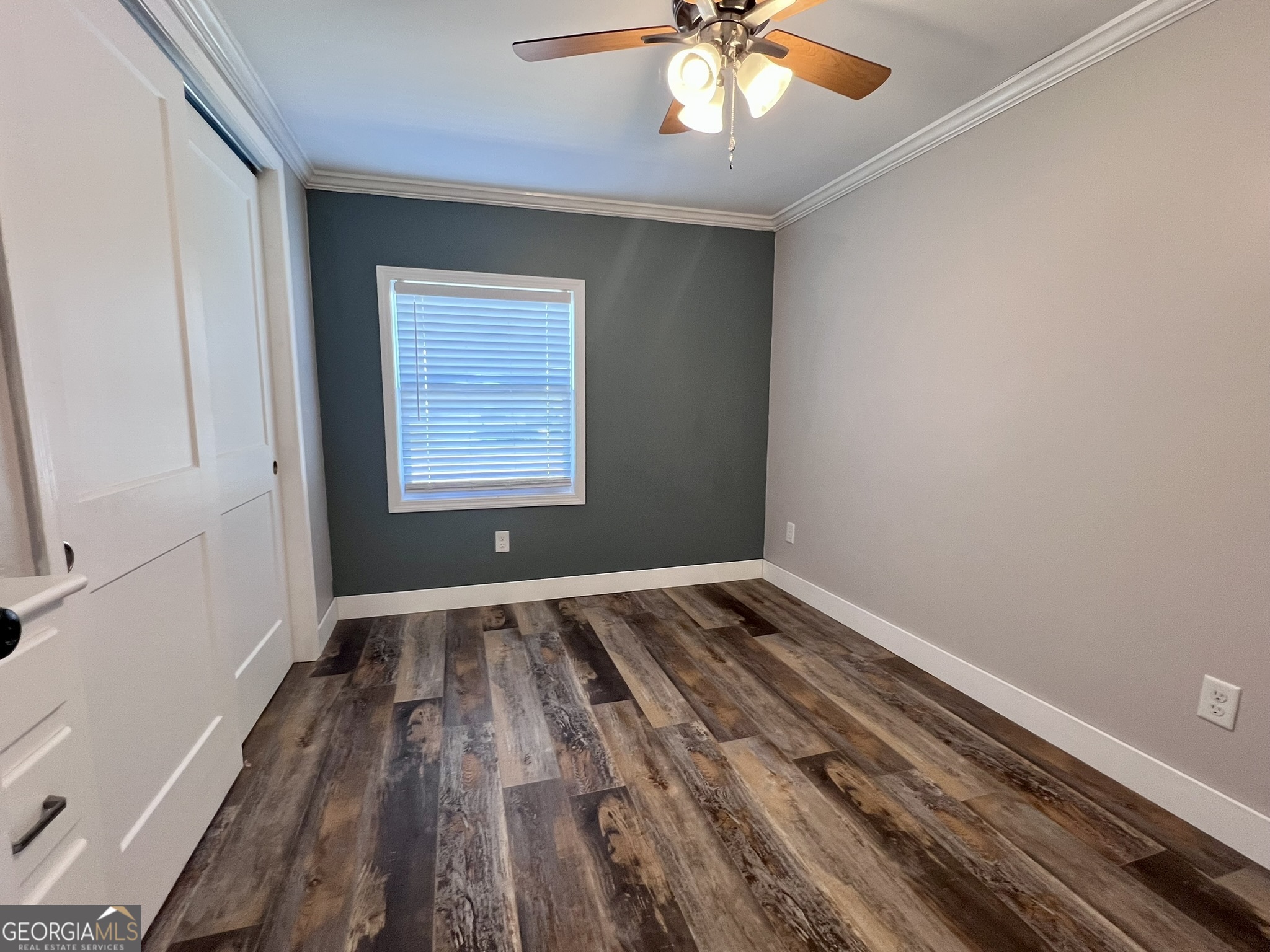 145 Sycamore Street Jesup, GA 31545 - Photo 9 of 14 a view of an empty room and window