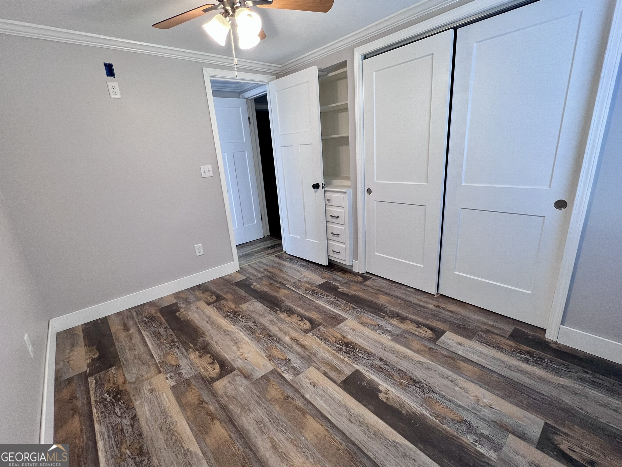 145 Sycamore Street Jesup, GA 31545 - Photo 10 of 14 a view of a room with wooden floor
