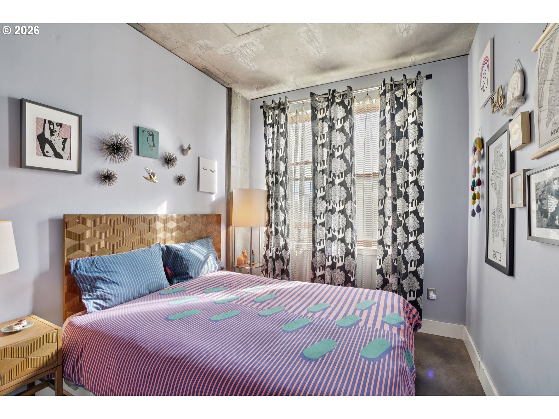 411 Northwest Flanders Street, Unit 302 Portland, OR 97209 - Photo 20 of 41 a bedroom with a bed and a window