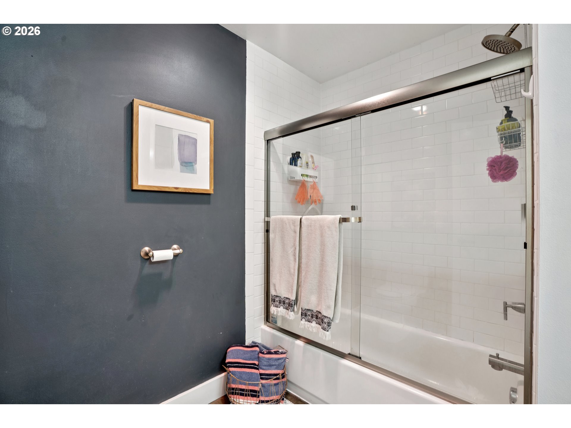 411 Northwest Flanders Street, Unit 302 Portland, OR 97209 - Photo 25 of 41 a bathroom with a shower curtain and a sink